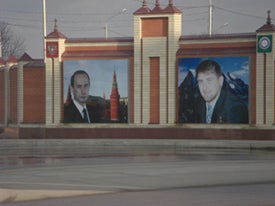 Portraits of President Vladimir Putin and President Ramzan Kadyrov alongside a road in Grozny.  2008 Tanya Lokshina / HRW