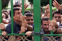 Students try to force open the gates to Cairo University, which had been closed following protests in Oct. 3, 2000 Photo: Aladin Abdel Naby/Reuters