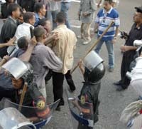 Protester being taken away by plainclothes security personnel in Bab al-Luq, near the Hurriyya cafe � 2005 Joshua Stacher 