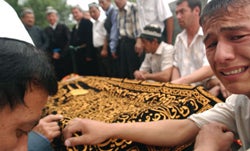 A man mourning at the funeral for his brother, who was killed during the Andijan events. � 2005 Yola Monakhov