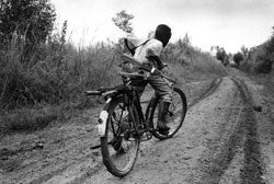 A child soldier rides back to his base in Ituri Province, northeastern Congo. � 2003 Marcus Bleasdale