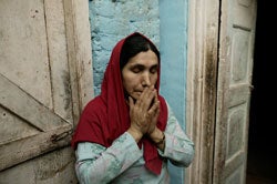 A mother cries while recalling her son who went missing in Kashmir.Human Rights Watch has documented forced disappearances all over the world. � 2005 Robert Nickelsberg