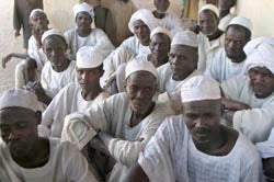 Elders of the Fur ethnic group meet in the Kass camp for internally displaced persons in Sudan. They have sought refuge in the camp since fleeing their village, which was attacked by government-supported militias earlier in the year. Photo: Evelyn Hockstein/Reuters