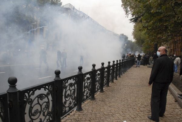 Protestors disperse along Rustaveli Avenue in downtown Tbilisi following an attack by riot police. 

