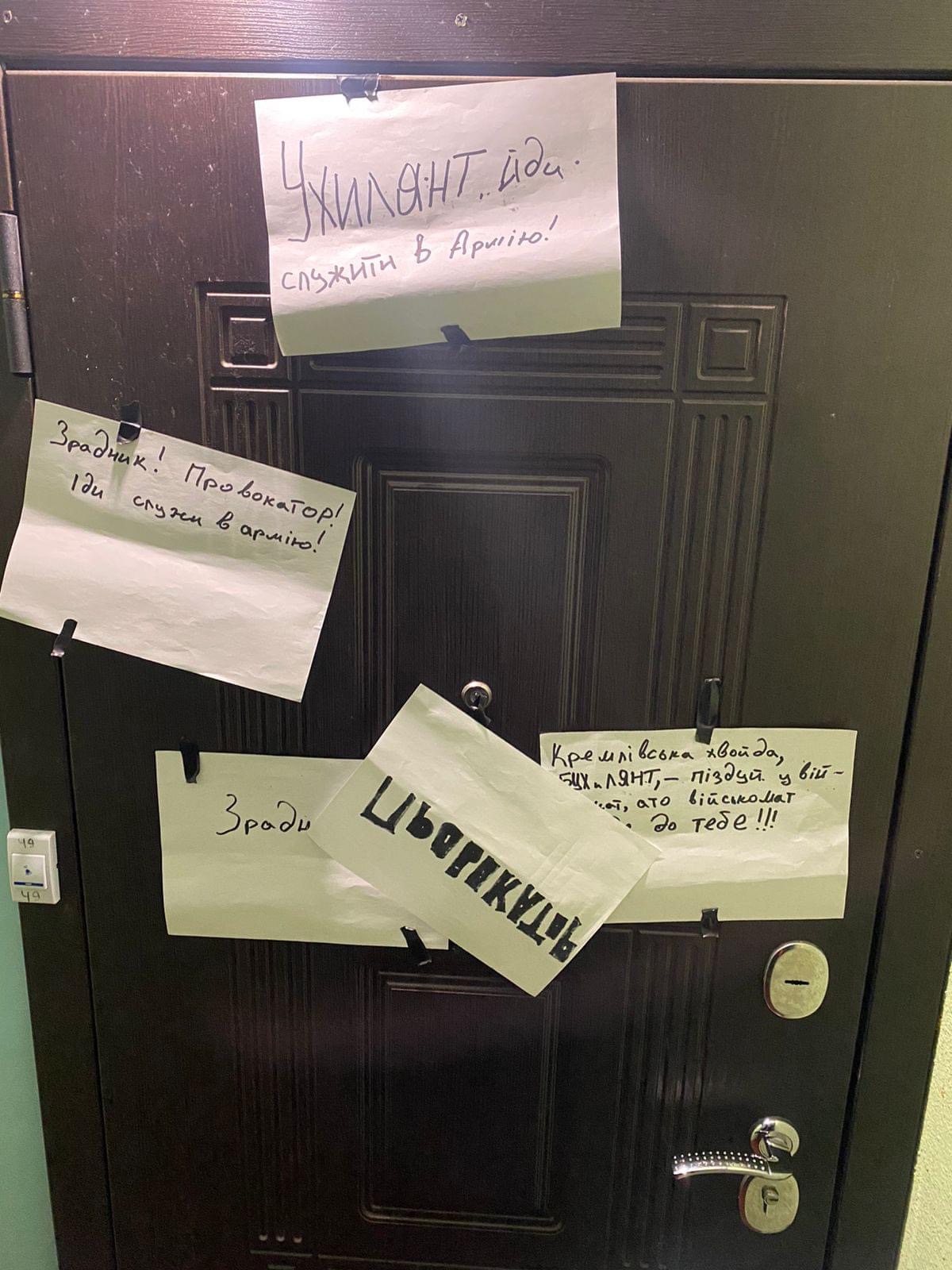 Messages stuck toYurii Nikolov’s door calling him a “traitor” and a “provocateur”,  Ukraine, January 14, 2024. 