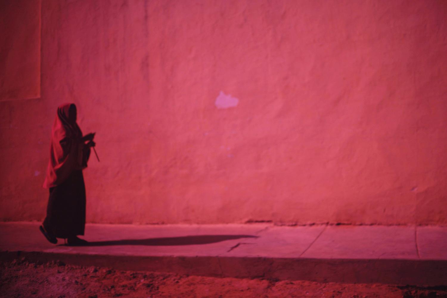 A Somali woman walks alone in central Mogadishu.