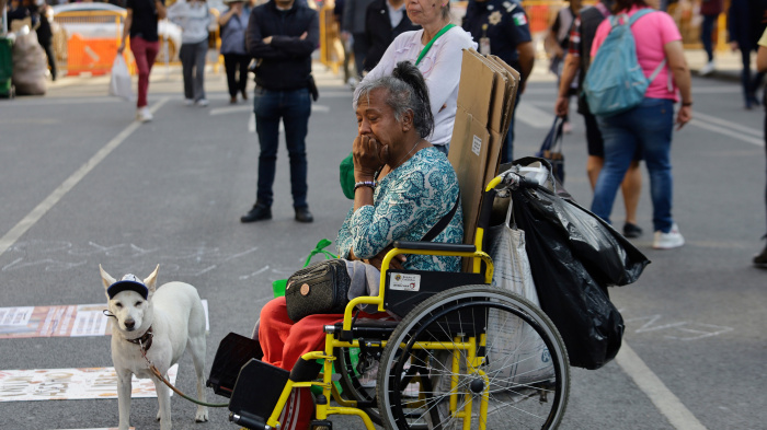 A dog and a woman with a disability outside the Supreme Court of Justice of the Nation in Mexico City, Mexico, March 24, 2026.