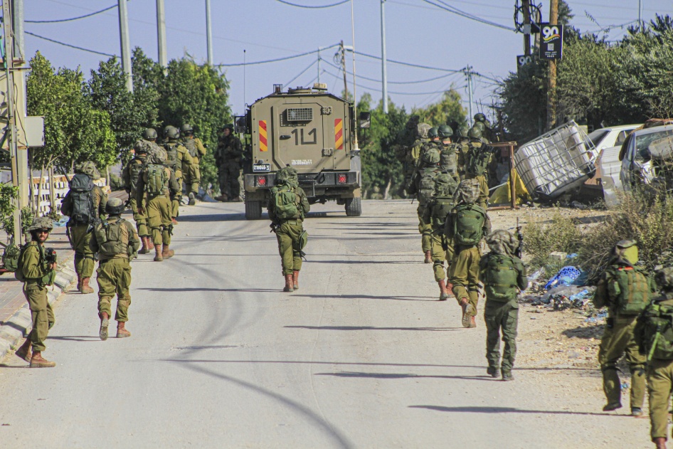 Israeli forces enter the Balata refugee camp in the occupied West Bank city of Nablus during a large-scale search-and-arrest operation on November 23, 2023. 