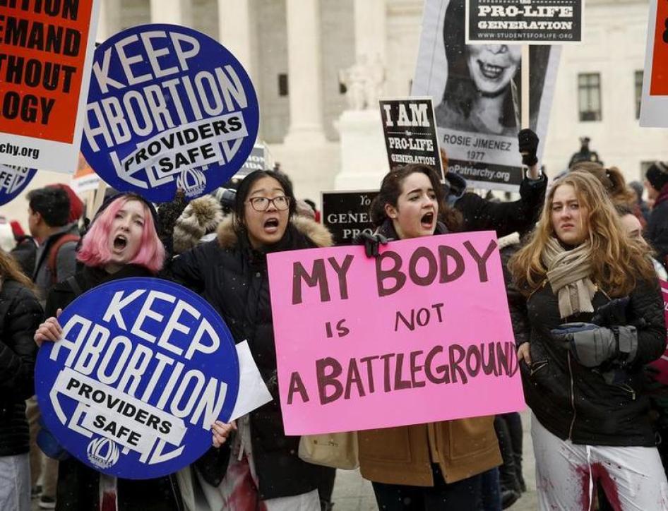 Pro-abortion supporters demonstrate in front of the U.S. Supreme Court (not pictured) during the National March for Life rally in Washington January 22, 2016.