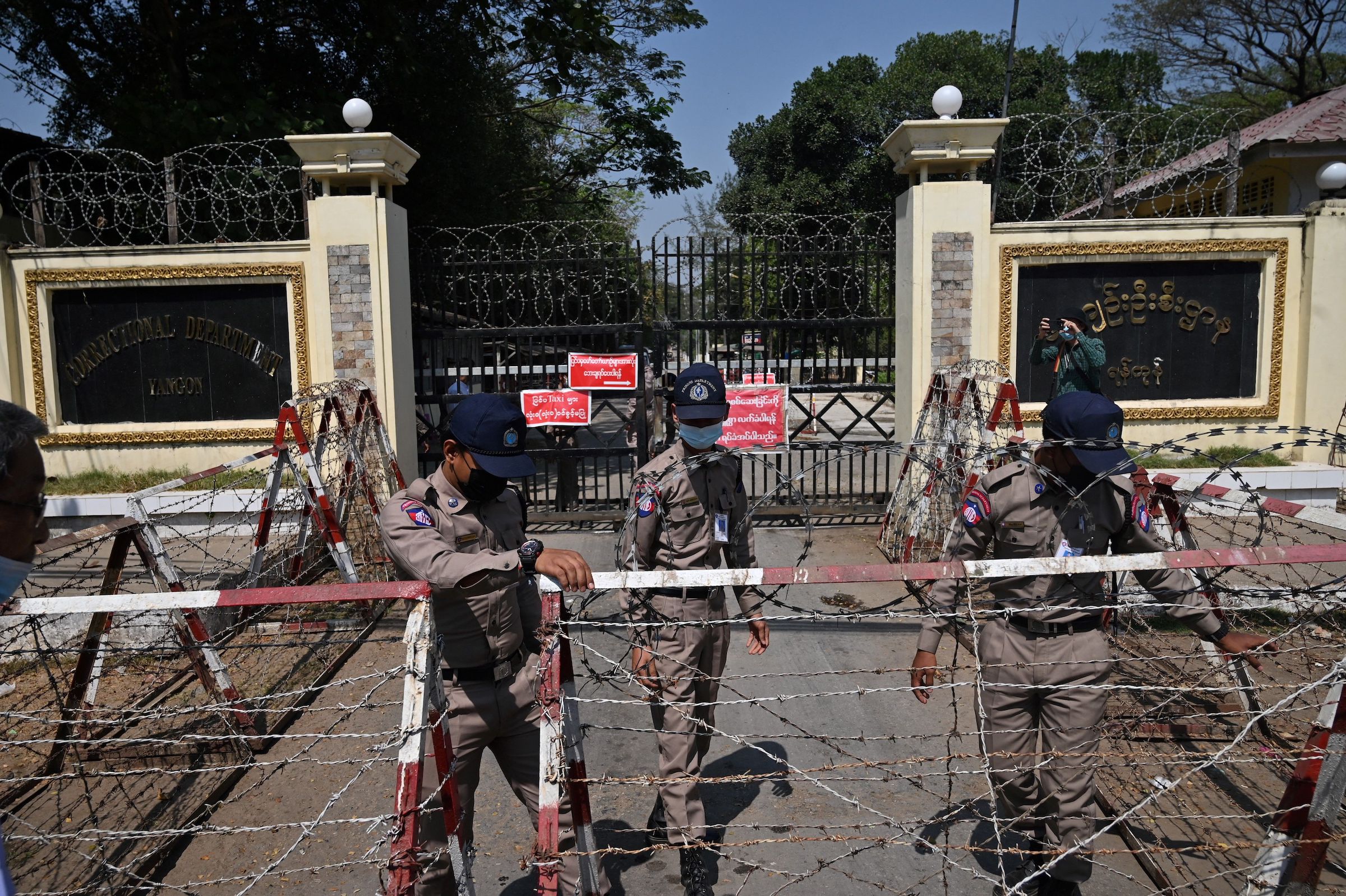  Prison officials outside of Insein prison in Yangon, February 12, 2022. 