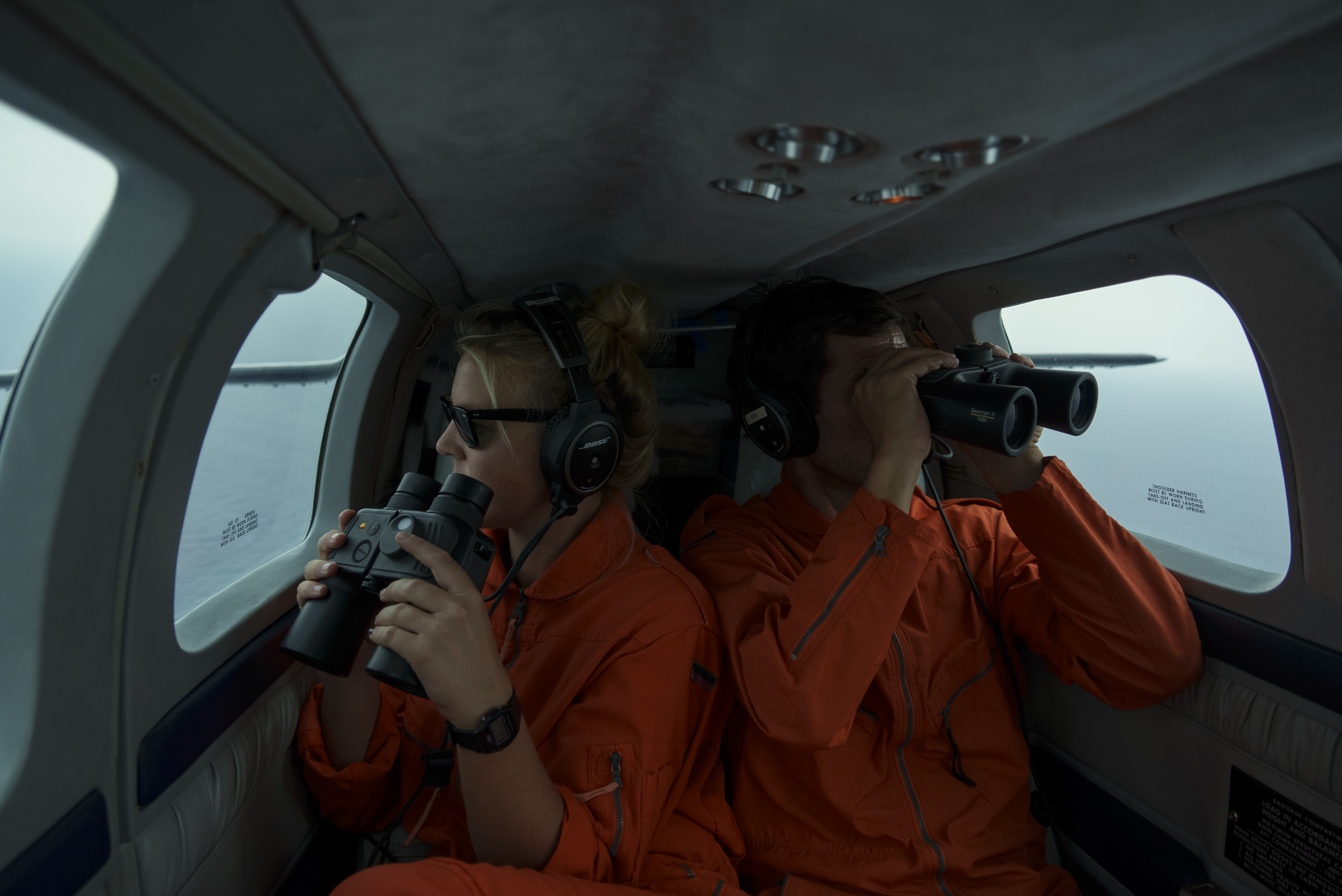 Volunteers aboard the Seabird, a plane operated by the rescue NGO Sea-Watch, look for boats in distress as they fly over the Mediterranean Sea between Libya and the Italian island of Lampedusa, October 5, 2021.