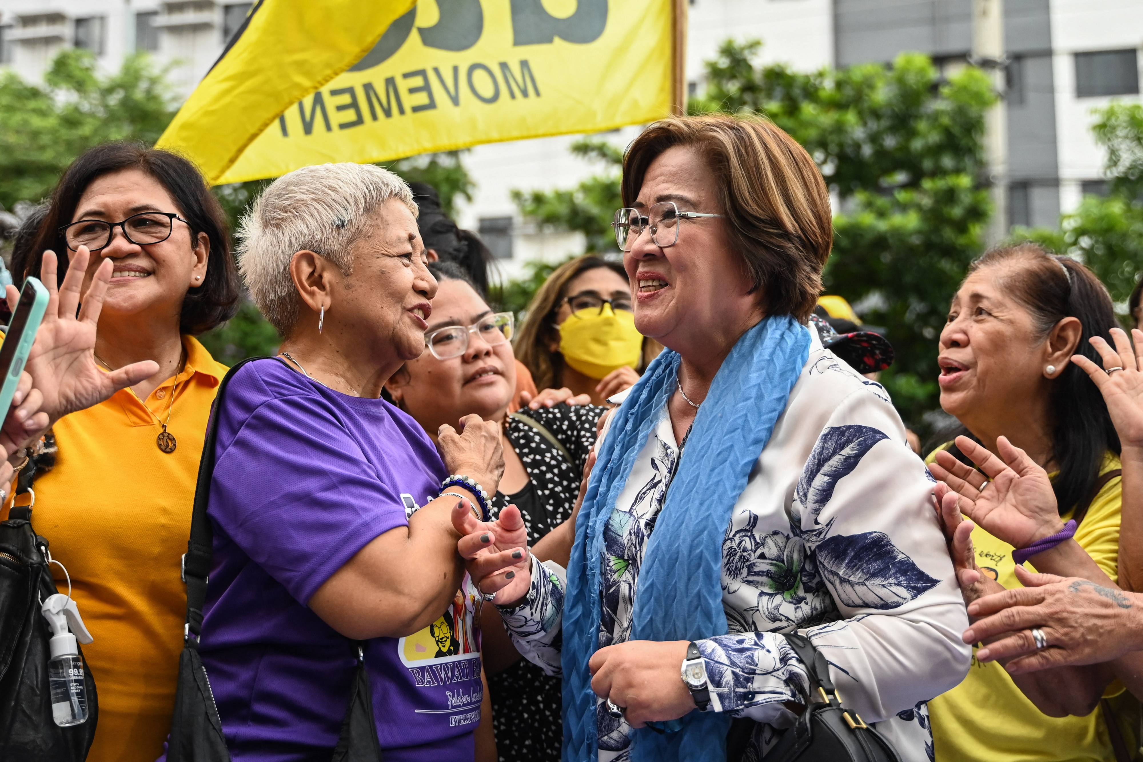 Former senator and human rights lawyer Leila de Lima (center right) acknowledges supporters after a court acquitted her of the last criminal charges against her, outside the court in Muntinlupa, Manila, Philippines, June 24, 2024. 