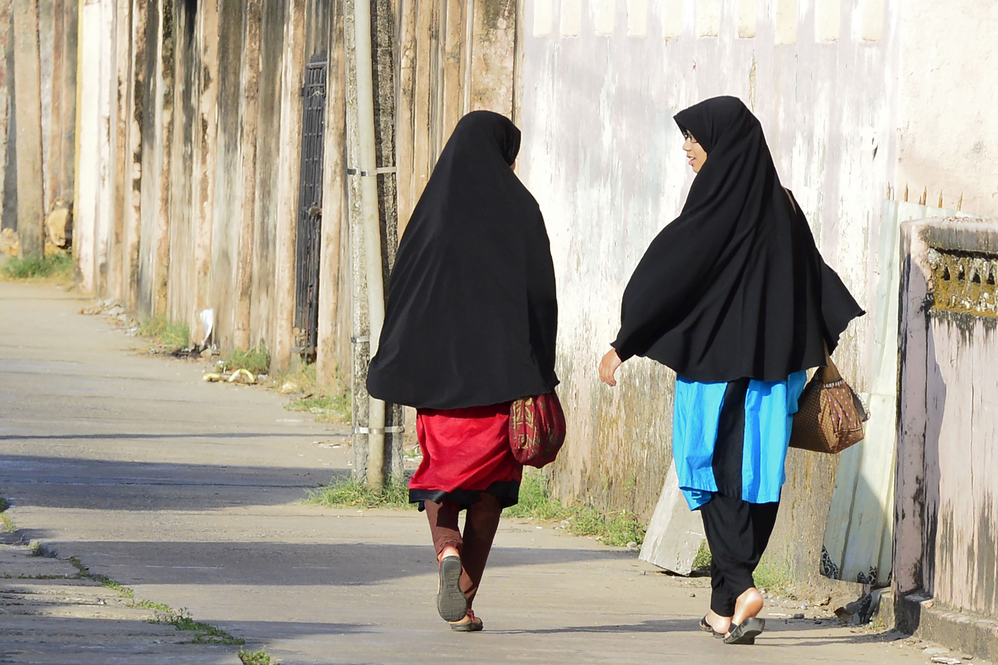 Girls walk along a road in Kattankudy, Sri Lanka, April 25, 2019.