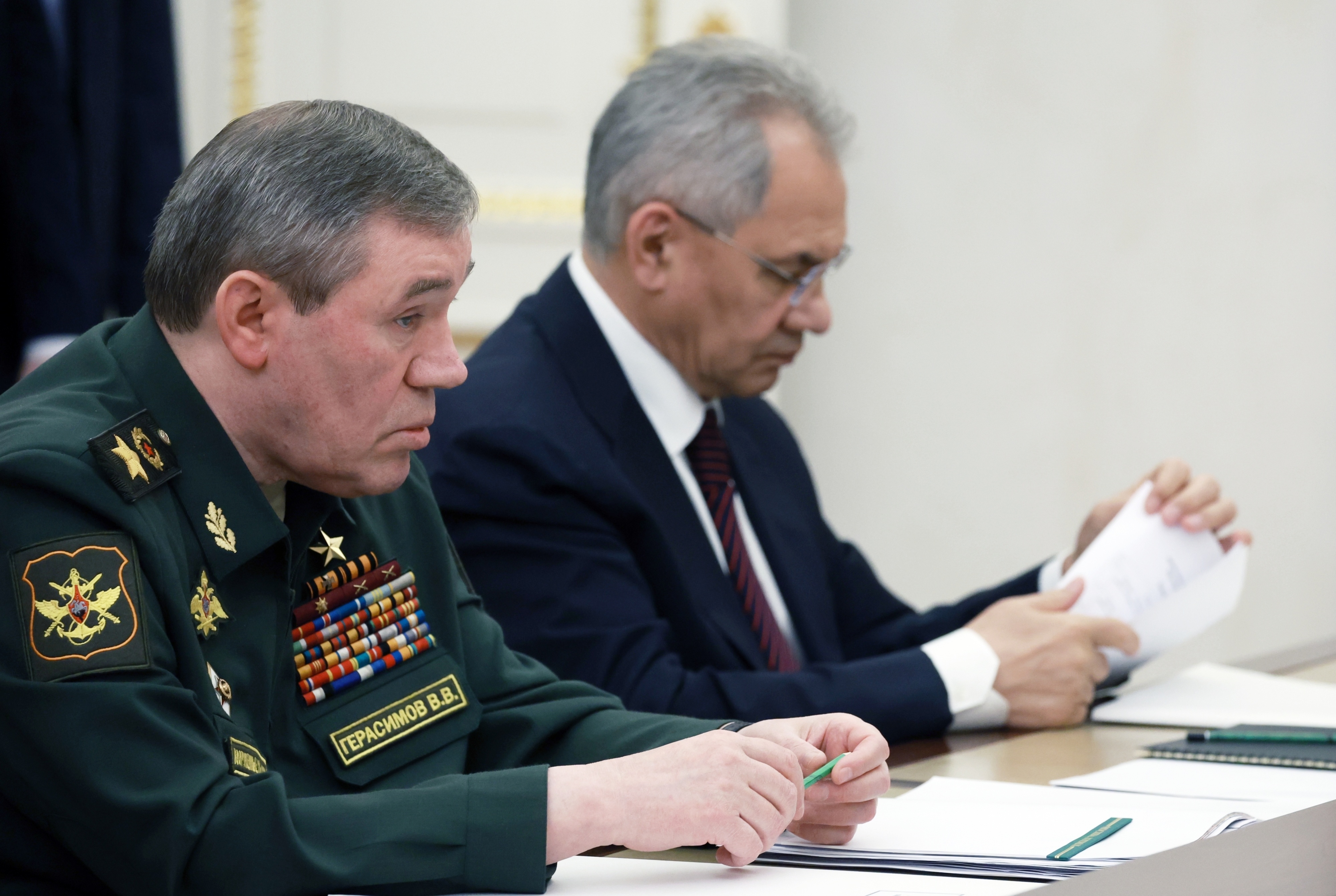 Former Russian Defense Minister Sergei Shoigu, right, and Russian Chief of General Staff Gen. Valery Gerasimov attend a meeting of Russian President Vladimir Putin with commanders of military districts at the Kremlin in Moscow, Russia, May 15, 2024. 