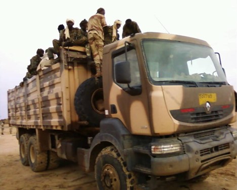 People ride in an open-air truck