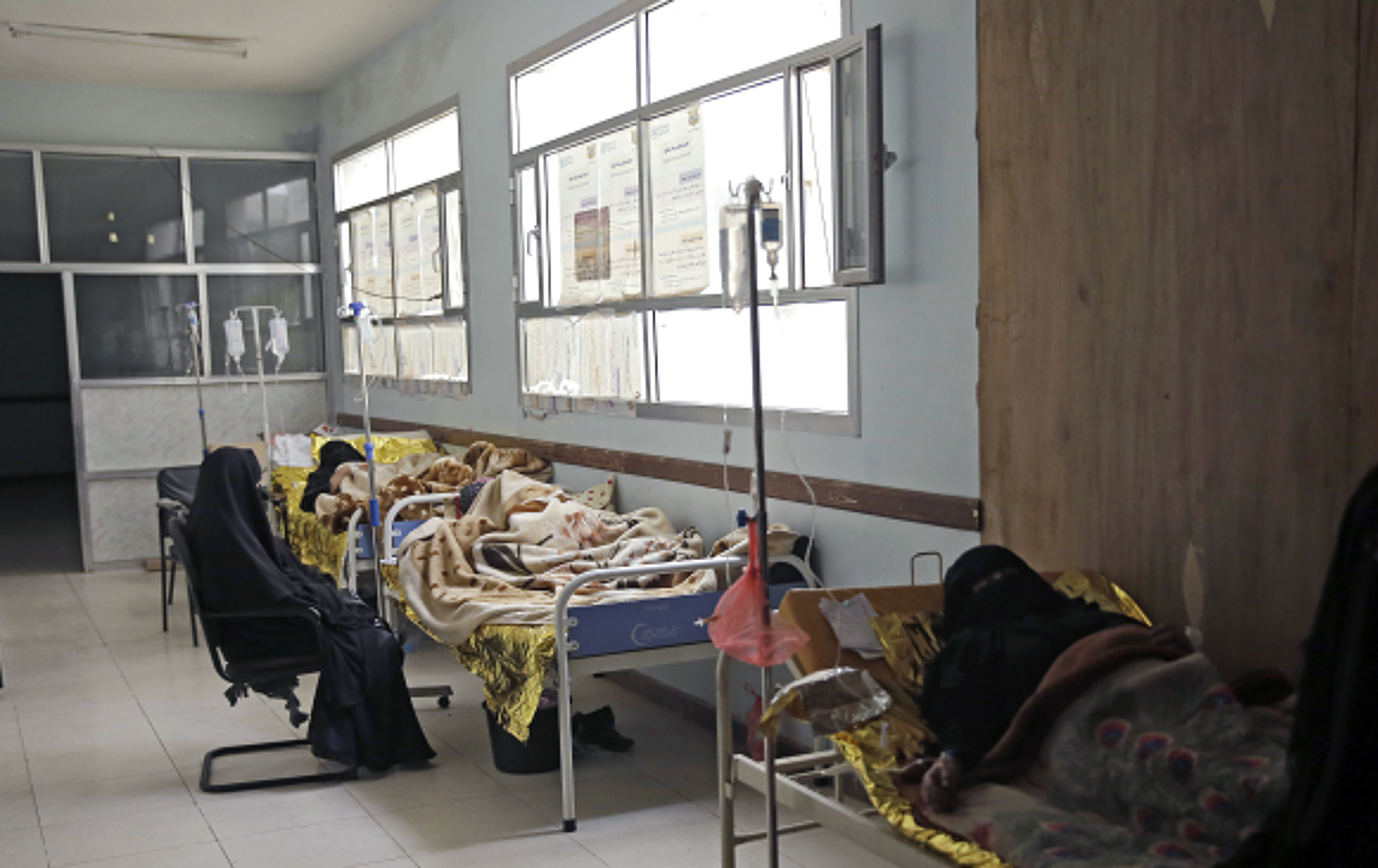 People are treated for suspected cholera infection at a hospital in Sanaa, Yemen,  March 28, 2019.