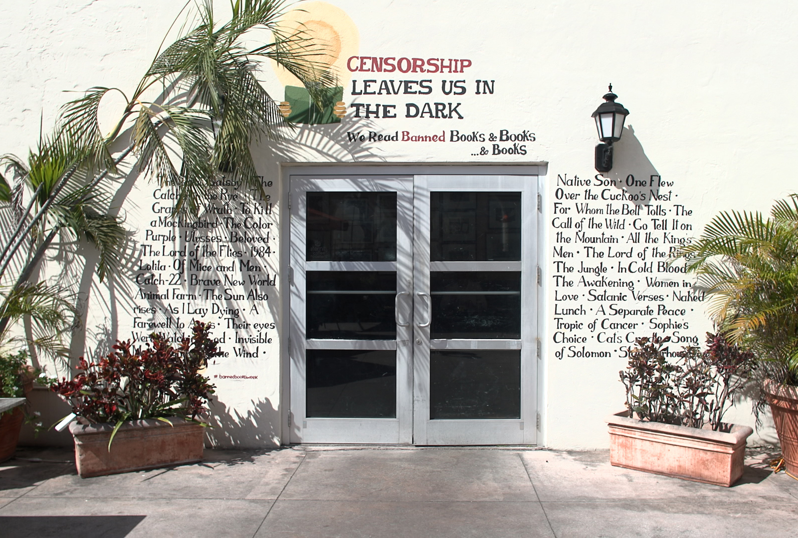 Books & Books’s “censorship leaves us in the dark” mural listing books banned from Florida public school libraries, Coral Gables, Florida.