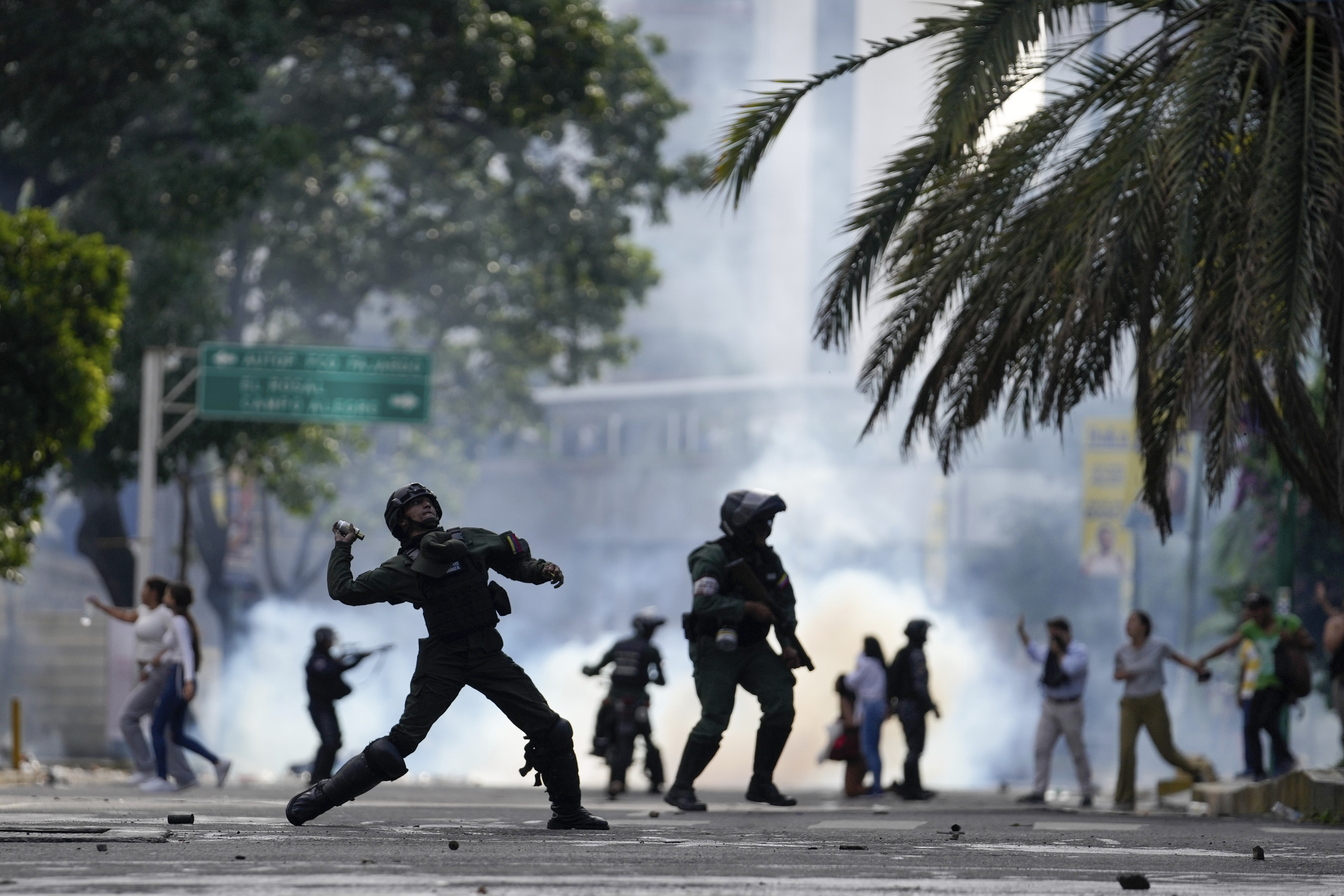 Police hurl a tear gas canister at protesters demonstrating against the announced election results declaring Nicolas Maduro's reelection, the day after the vote, in Caracas, Venezuela, July 29, 2024.