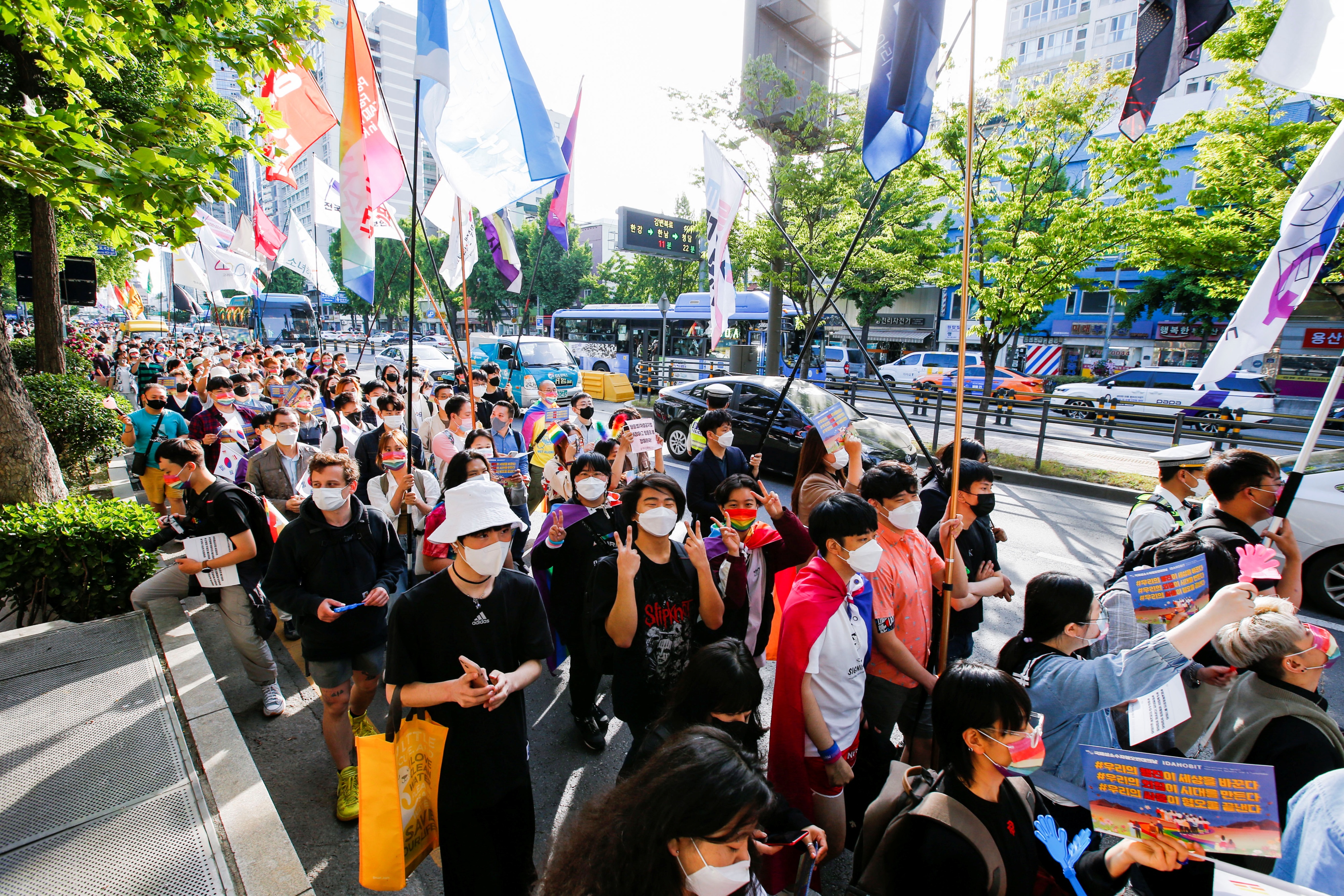 Members of the LGBTQ+ community march towards the new presidential office during a protest ahead of the International Day Against Homophobia, Transphobia and Biphobia, in Seoul, South Korea, May 14, 2022.