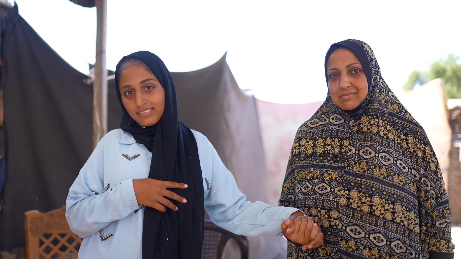 Ghazal and her mother photographed in a displacement camp