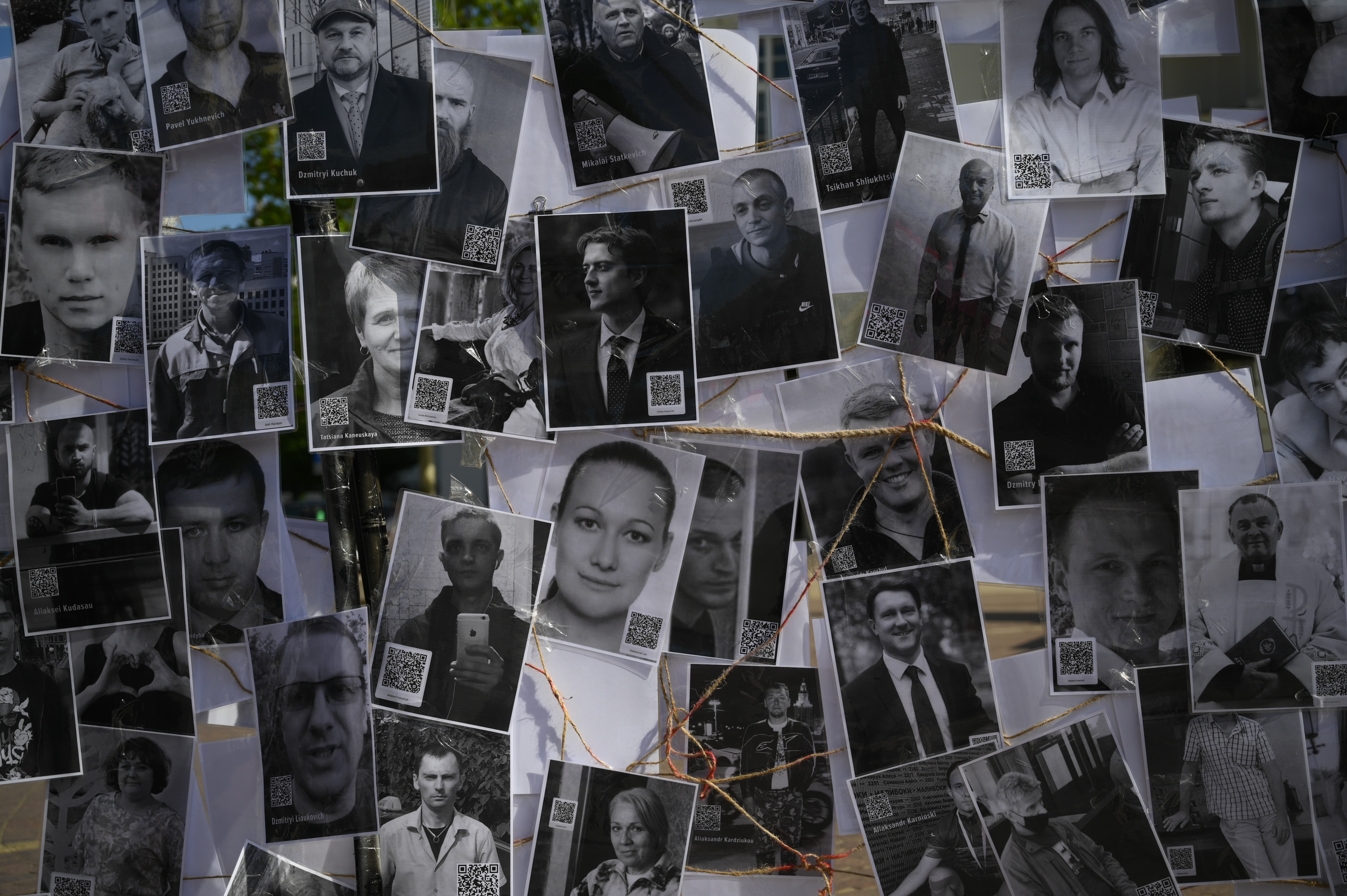 A collage of photos portrays some of the hundreds of political prisoners currently detained in Belarus, displayed during a demonstration in Warsaw, Poland, May 18, 2024.