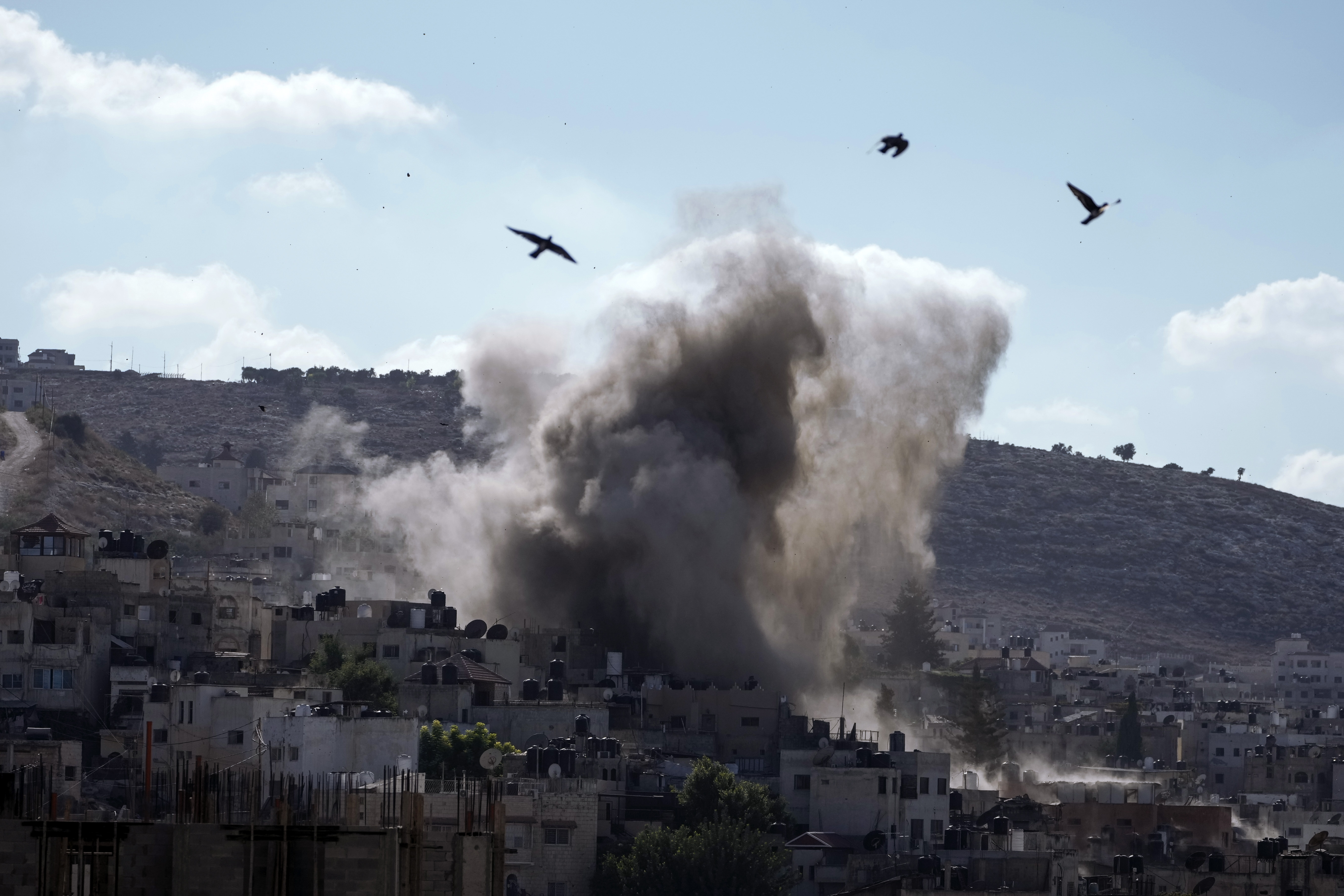 An explosion is seen during an Israeli military operation in the West Bank city of Jenin, September 5, 2024.