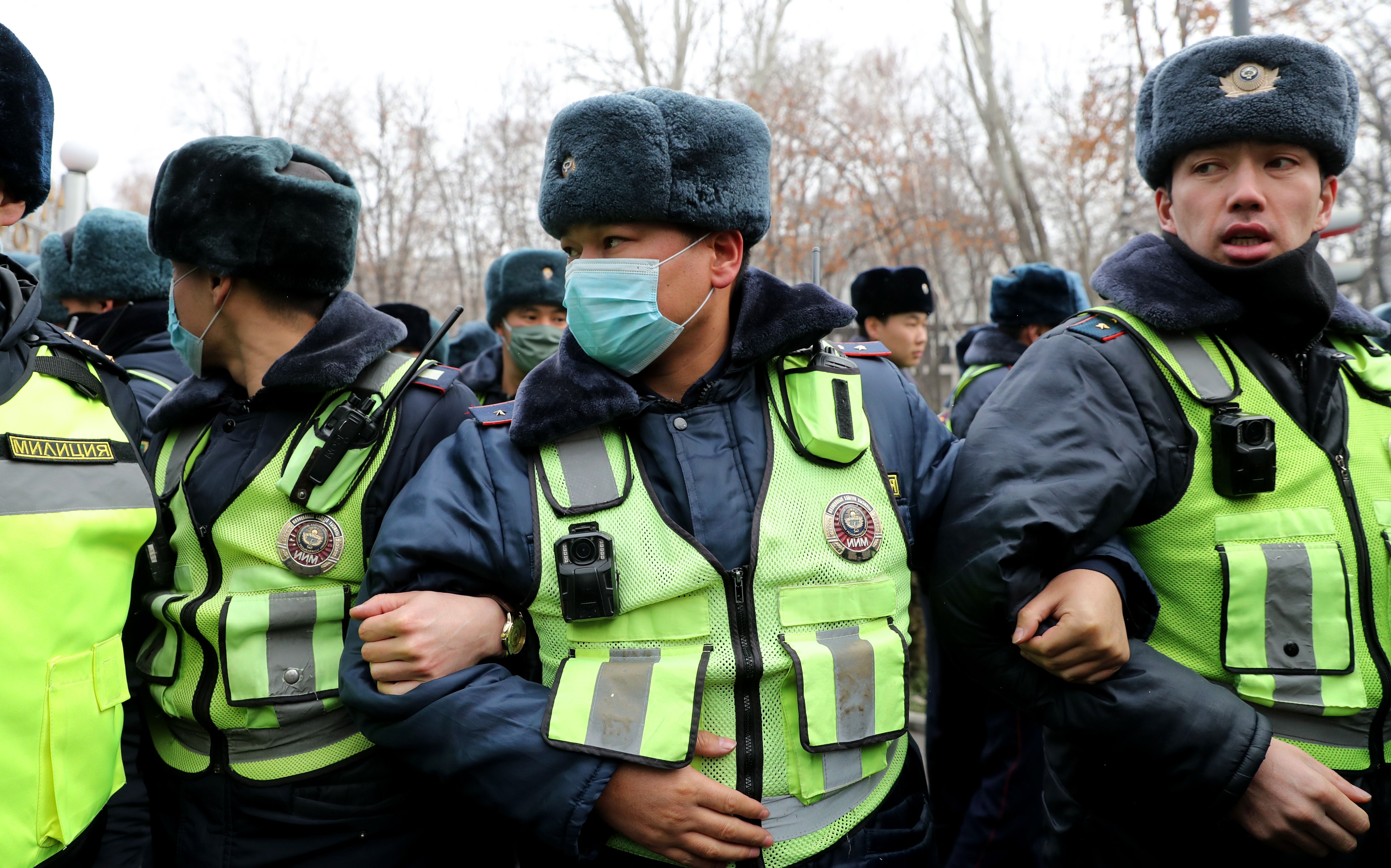 Police are deployed as people gather in support of a detained journalist, outside the Ministry of Interior Affairs in Bishkek, Kyrgyzstan, January 23, 2022. 