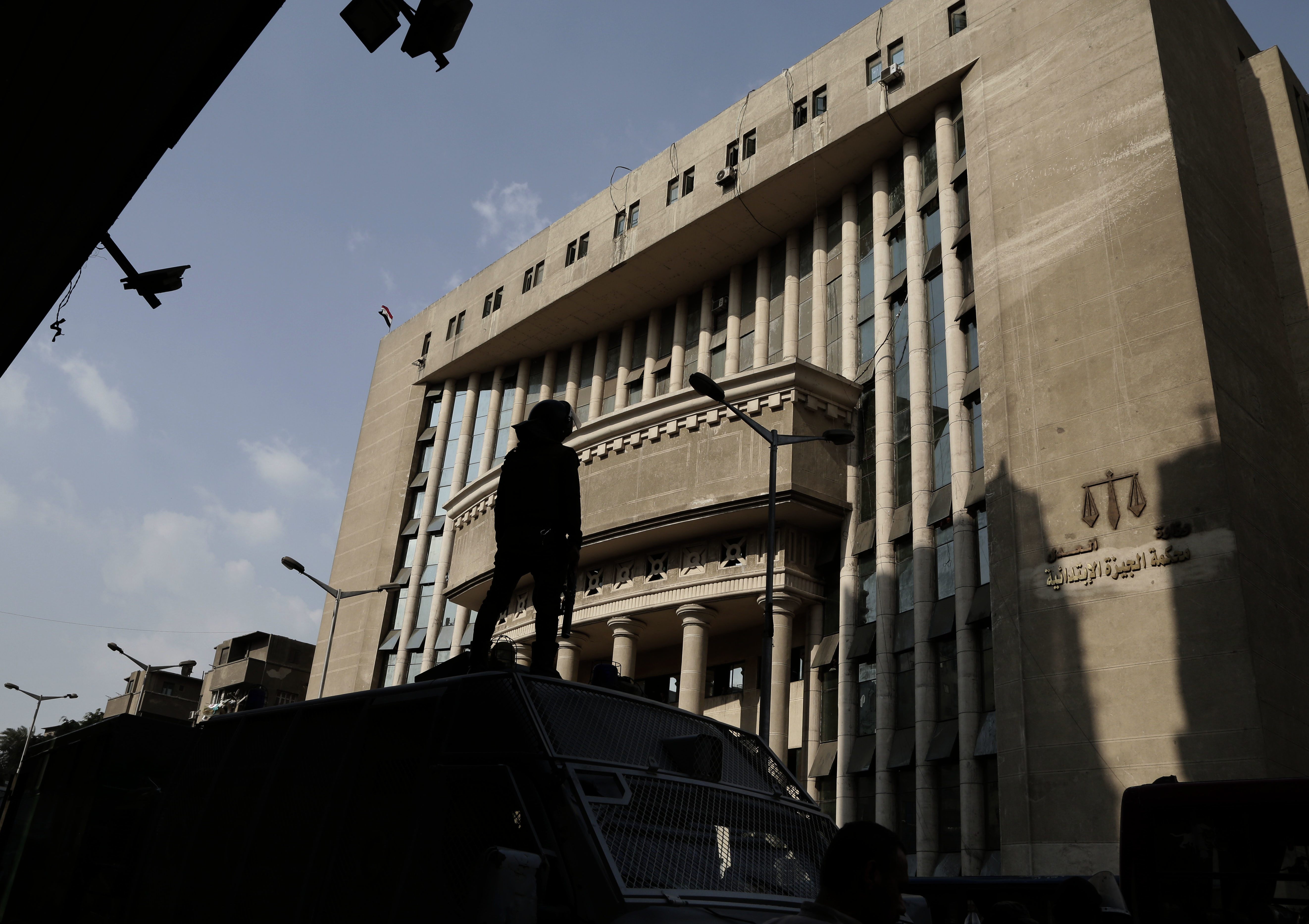 Egyptian security officers guard a courthouse as prominent Egyptian rights lawyer lawyer Khaled Ali, arrives for a hearing, in Cairo, Egypt, November 8, 2017. 