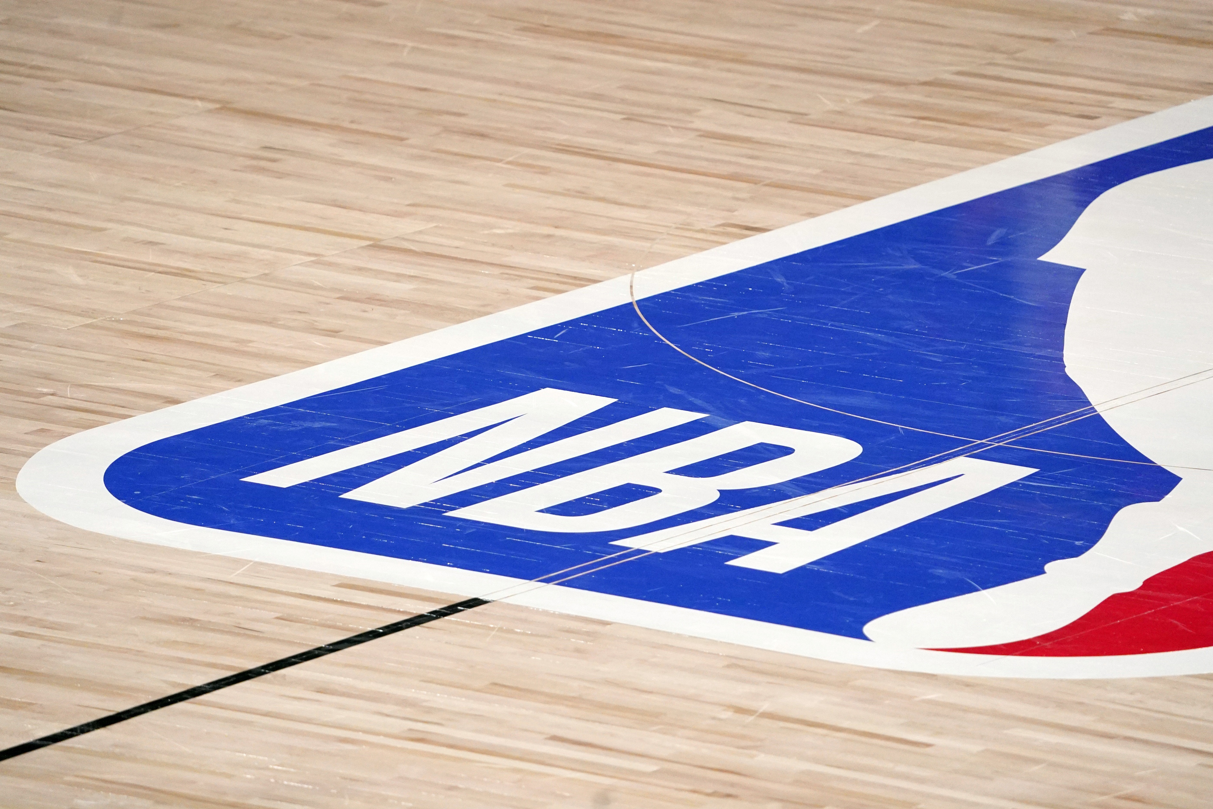 The NBA logo at center court. 