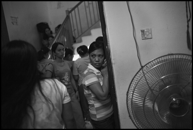 Workers continue to spend long periods waiting at embassy shelters, including the Philippines safe house, shown here. Since 1992, the Kuwaiti government has relied on deportation as the primary method for dealing with domestic workers who face employment-related problems. Workers reported spending weeks or months in official custody, moving from embassy shelters to police stations, and from there to criminal investigation facilities, before they were sent to deportation detention.