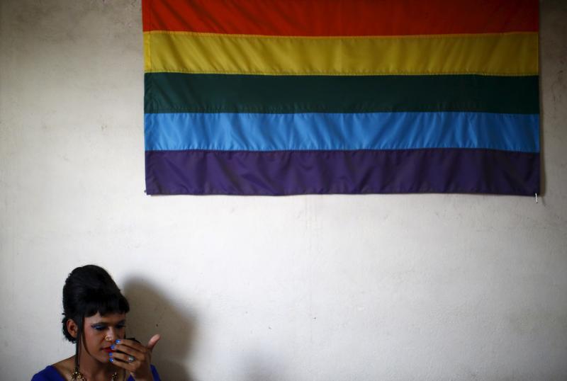 A reveller gets ready to take part in a LGBT pride parade to mark Gaijatra Festival, also known as the festival of cows, in Kathmandu, Nepal August 30, 2015.