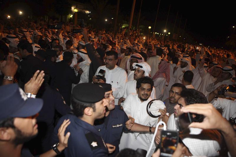 Kuwaitis protest outside the parliament building in Kuwait City November 16, 2011.