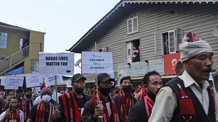 Ethnic Nagas hold placards and participate in a 70-kilometer walk demanding the repeal of the Armed Forces Special Powers Act (AFSPA) in Kohima, Nagaland, India in 2022.