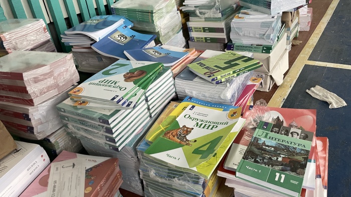 Copies of textbooks arranged on a table