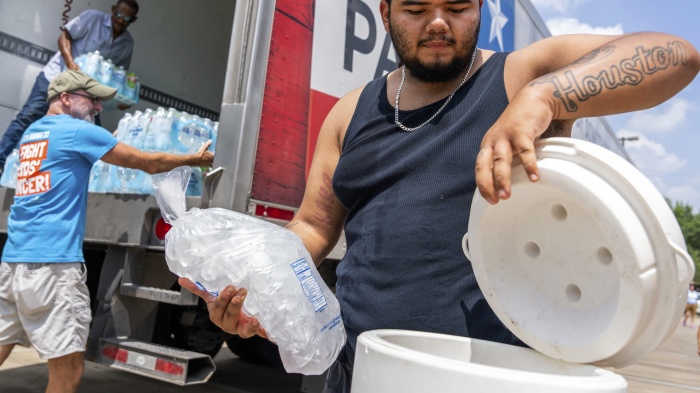 Memorial Assistance Ministries distribute water and ice during extreme heat in Houston, Texas, US, May 18, 2024. 