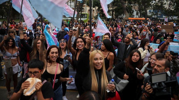 Peruvians protest in front of Peru's Ministry of Health against a presidential decree classifying transgender identities as mental health conditions in Lima, Peru, May 17, 2024.