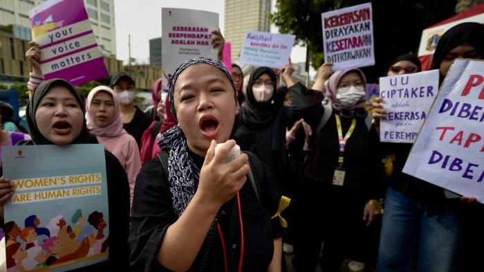 Indonesian women march to demand the Indonesian government enacts an anti-discrimination law and to advocate for ending sexual violence and harassment at work, March 8, 2024.