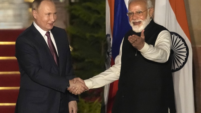 Russian President Vladimir Putin and Indian Prime Minister Narendra Modi greet each other before their meeting in New Delhi, India, December 6, 2021.