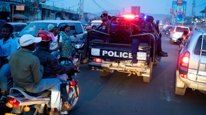 Police car driving through Goma, Democratic Republic of Congo