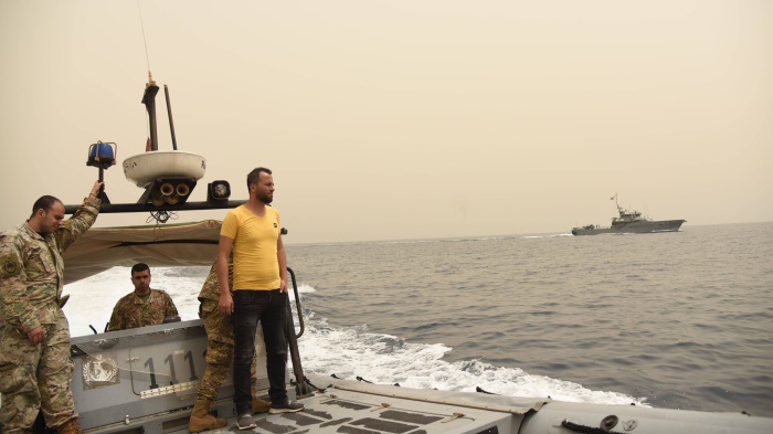 Men on a military boat at sea