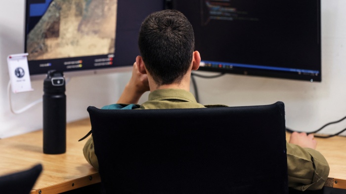 A technologist with the Israeli military's Matzpen operational data and applications unit works at his station, at an Israel Defense Force base in Ramat Gan, Israel, June 11, 2023. 