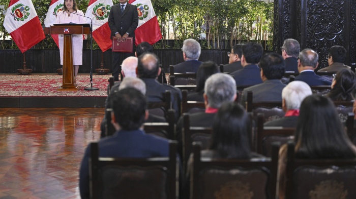 Peru's President Dina Boluarte delivers a speech during a ceremony enacting an amnesty law for military and police personnel prosecuted for human rights violations at the Government Palace in Lima on August 13, 2025. 