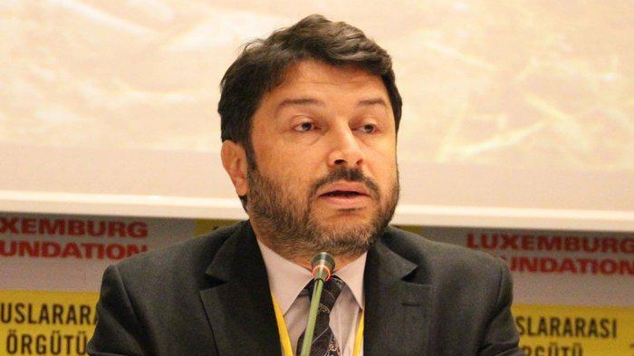 Taner Kilic, head of Amnesty International Turkey, speaks at a conference.