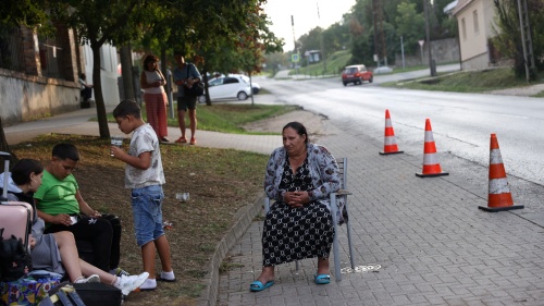 A Ukrainian woman of Roma ethnicity sits on a chair on the street, after losing access to subsidized accommodation in Komárom-Esztergom county, Hungary, August 21, 2024. 