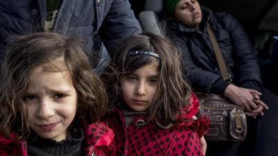  Two young Iranian sisters at the Idomeni border crossing between Greece and Macedonia.  January 26, 2016.