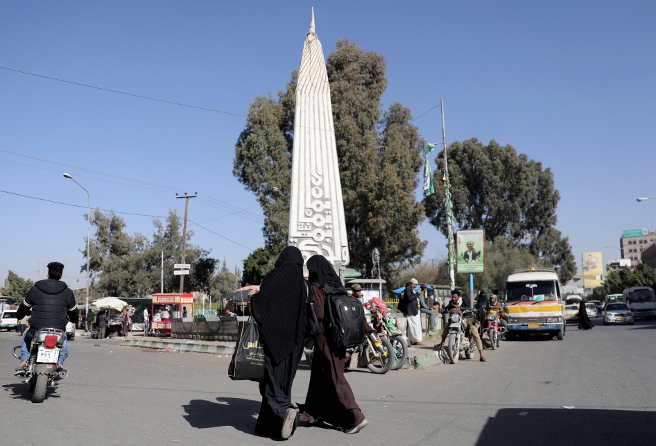 Women walk at the “Change Square” outside Sanaa University’s gate, Sanaa, Yemen. 