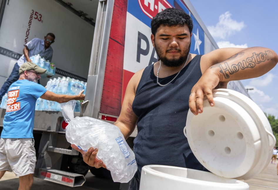 Memorial Assistance Ministries distribute water and ice during extreme heat in Houston, Texas, US, May 18, 2024. 