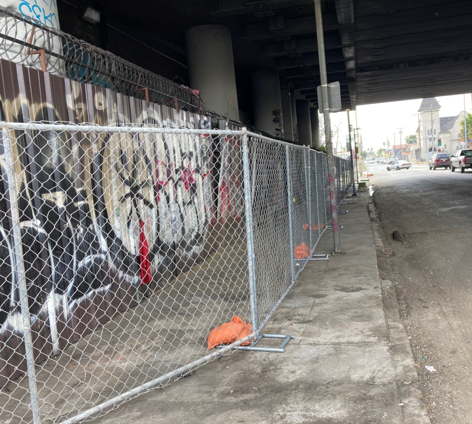 Fencing under a highway overpass