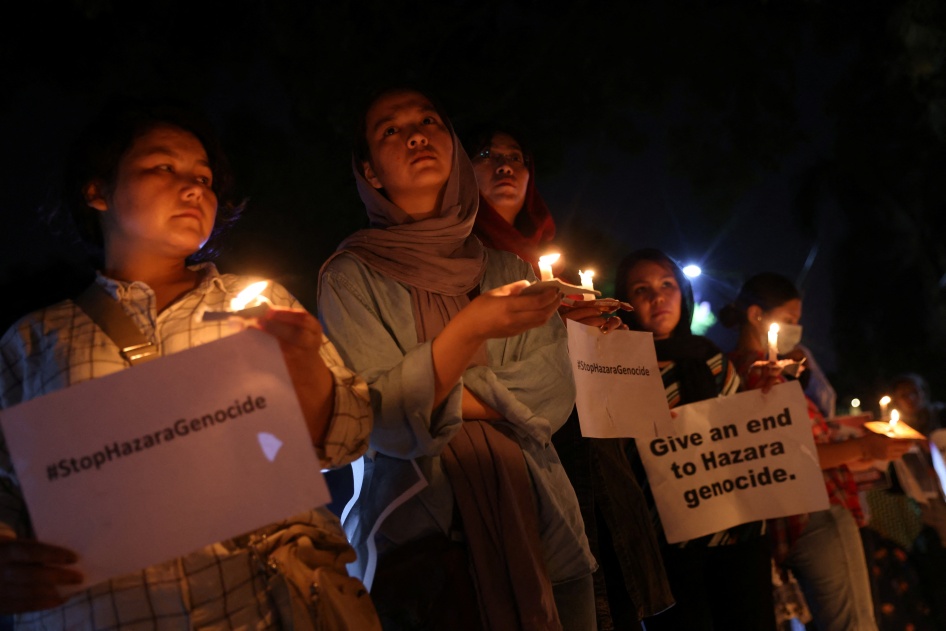 Members of Afghanistan’s Hazara community protest a suicide attack at a tutoring center in Kabul outside the UN refugee agency’s office in New Delhi, India, September 30, 2022.