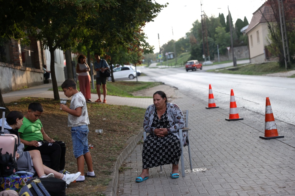 A Ukrainian woman of Roma ethnicity sits on a chair on the street, after losing access to subsidized accommodation in Komárom-Esztergom county, Hungary, August 21, 2024. 